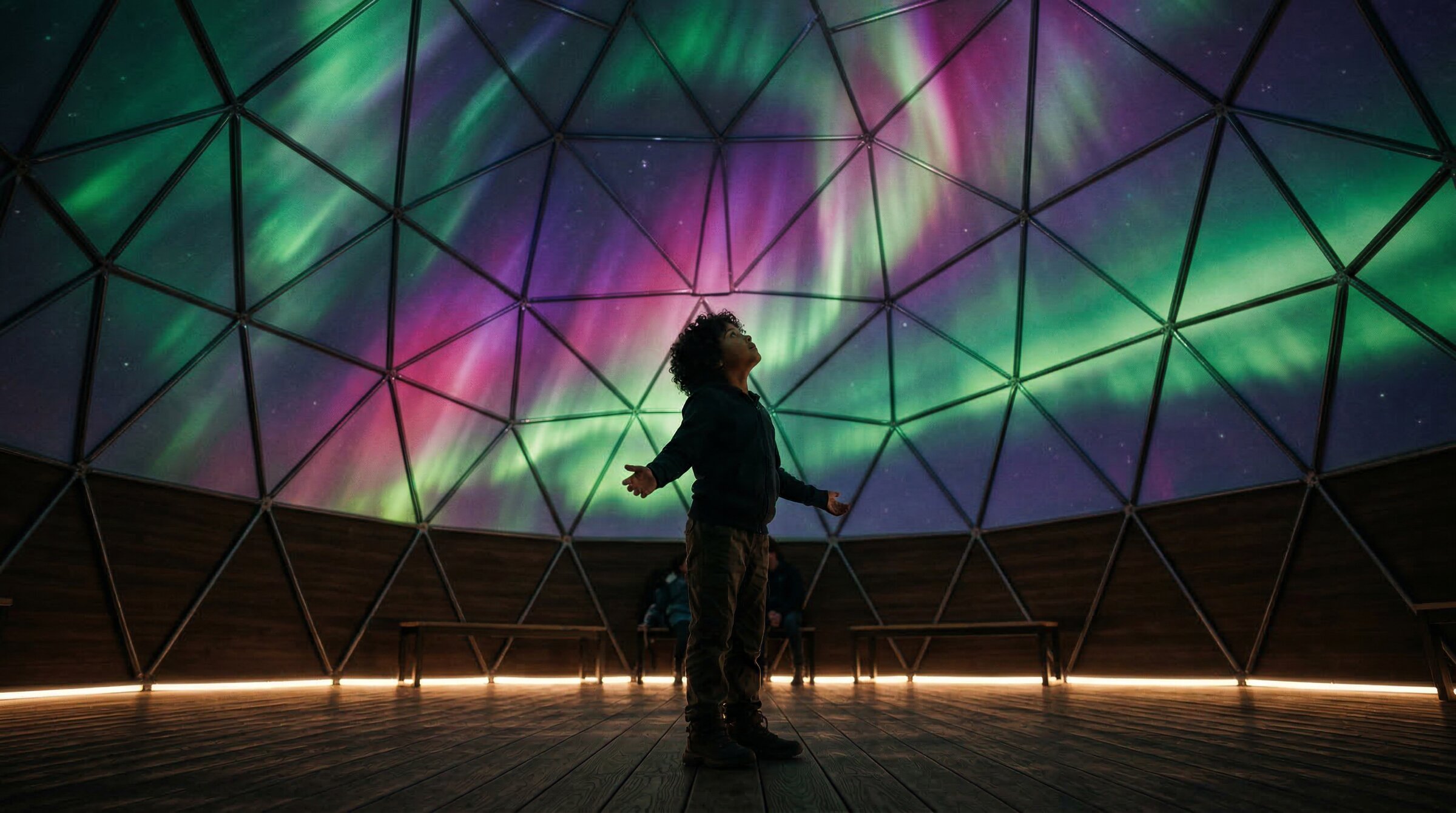 A child standing inside a dome with aurora borealis, arms outstretched in wonder